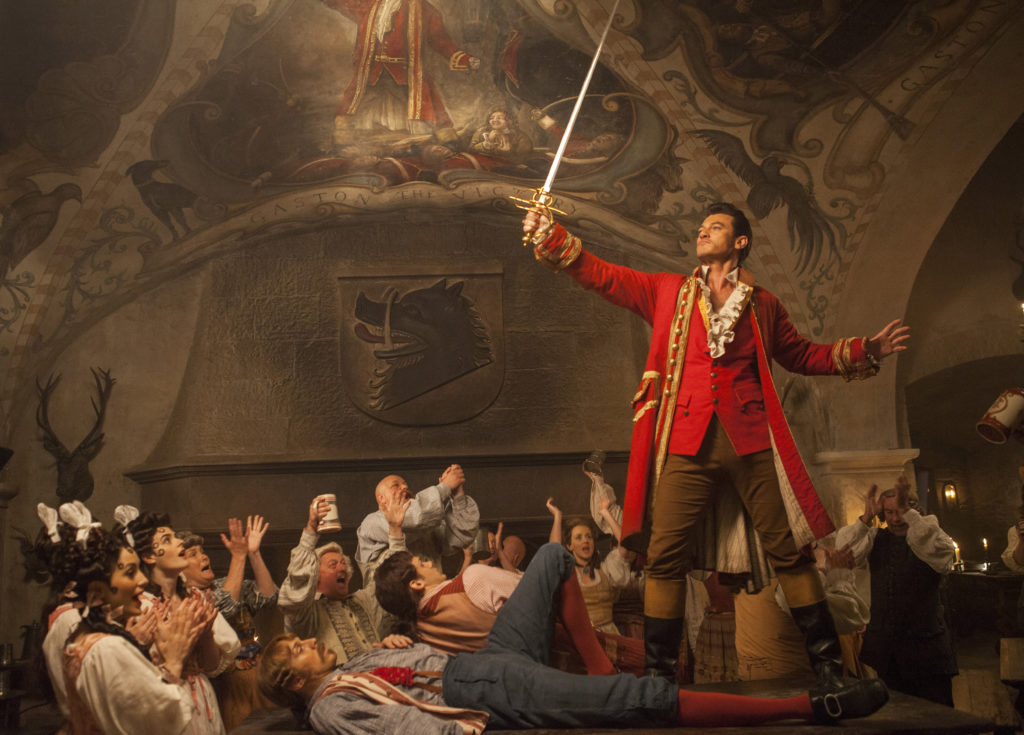 Gaston (Luke Evans) a handsome but arrogant brute, holds court in the village tavern in Disney's BEAUTY AND THE BEAST.