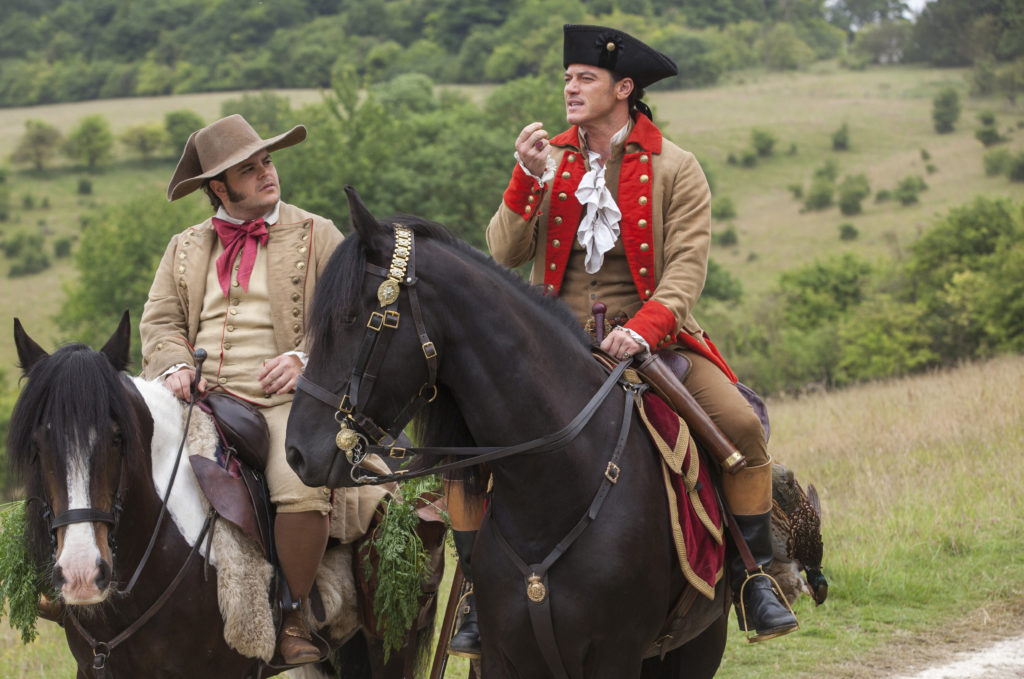 Luke Evans stars as  Gaston and Josh Gad as Le Fou in Disney's BEAUTY AND THE BEAST.